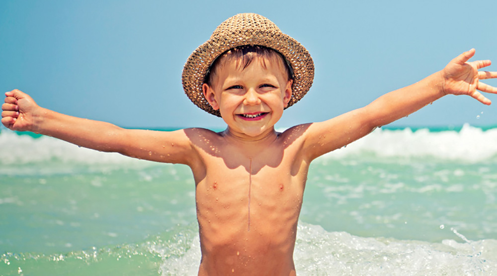boy with heart surgery scar on his chest.